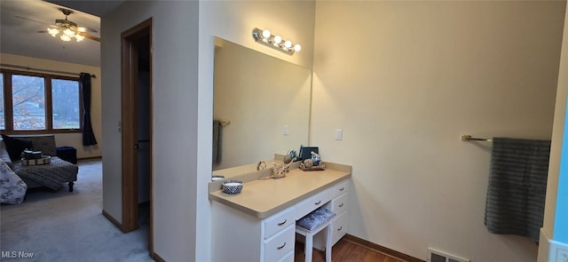 bathroom with visible vents, ceiling fan, and vanity