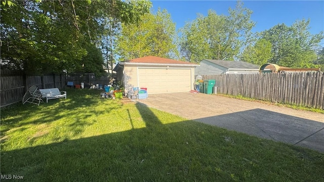 5031 Cato St, Maple Heights, OH 44137 - view of yard featuring a detached garage and an outbuilding