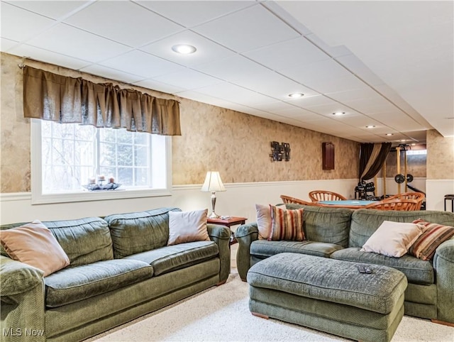 living room with recessed lighting, a drop ceiling, and wainscoting