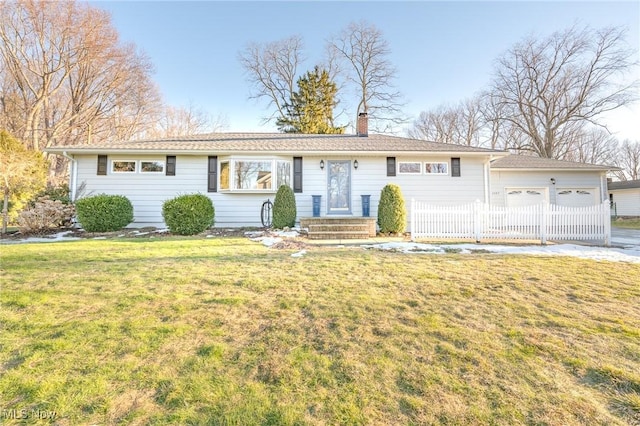 ranch-style home featuring a front lawn, a chimney, an attached garage, and fence