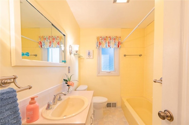 full bathroom featuring toilet, visible vents, shower / washtub combination, and vanity