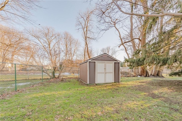 view of shed with a fenced backyard