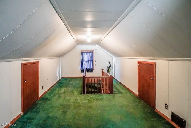 bonus room featuring carpet floors, lofted ceiling, and visible vents