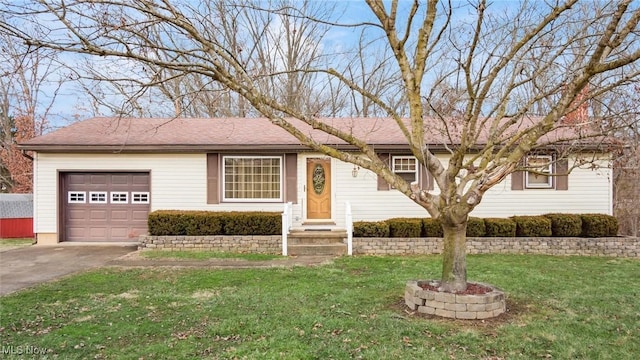 single story home featuring entry steps, driveway, a garage, and a front yard