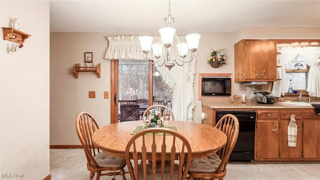 dining space featuring a chandelier, light colored carpet, a healthy amount of sunlight, and baseboards