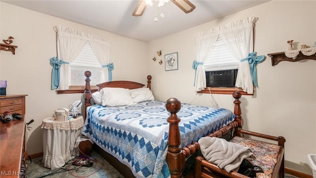 bedroom featuring a ceiling fan, cooling unit, and baseboards