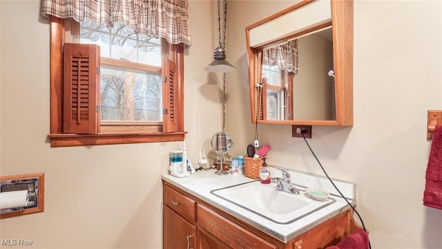 bathroom featuring vanity and a wealth of natural light