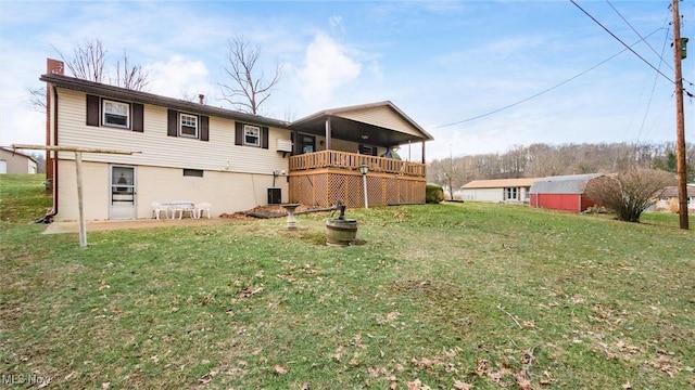 rear view of house with a yard