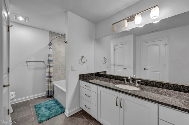 bathroom featuring toilet, shower / bath combo, vanity, and tile patterned floors