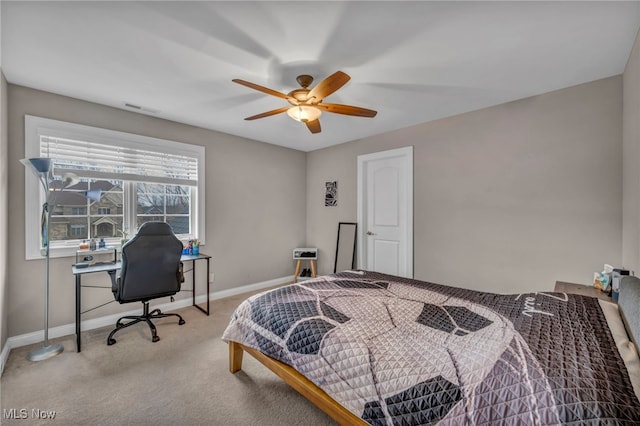 carpeted bedroom with baseboards, visible vents, and ceiling fan