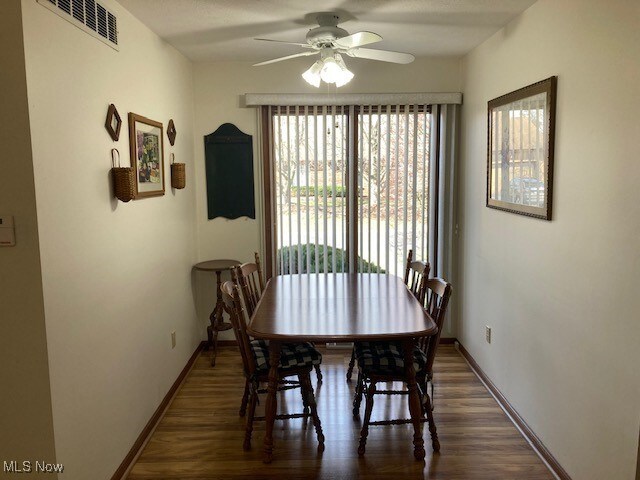703 Tournament Trl, Cortland, OH 44410 - dining area with a ceiling fan, baseboards, visible vents, and wood finished floors
