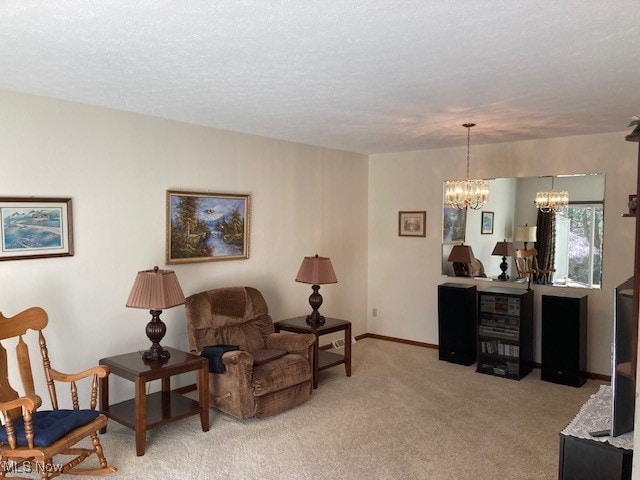 703 Tournament Trl, Cortland, OH 44410 - sitting room featuring baseboards, a chandelier, a textured ceiling, and light colored carpet