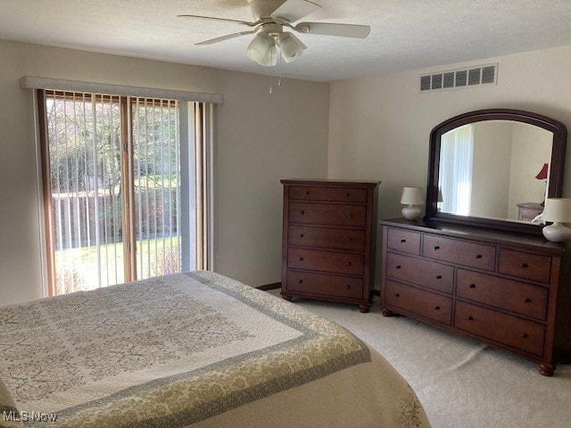 703 Tournament Trl, Cortland, OH 44410 - bedroom with light carpet, visible vents, ceiling fan, access to outside, and a textured ceiling