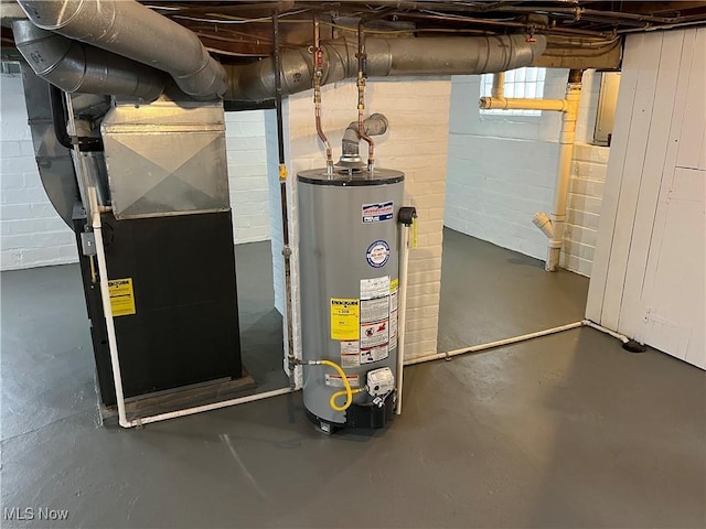 utility room featuring heating unit and water heater