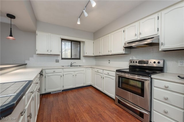 kitchen with under cabinet range hood, dark wood-type flooring, white cabinetry, stainless steel electric range, and tasteful backsplash