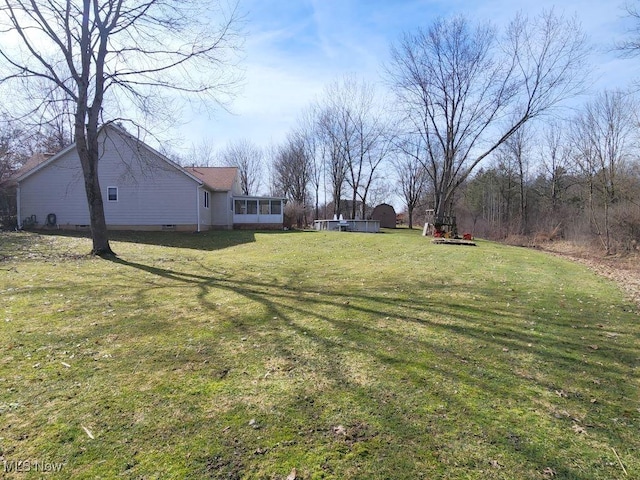 view of yard featuring a sunroom