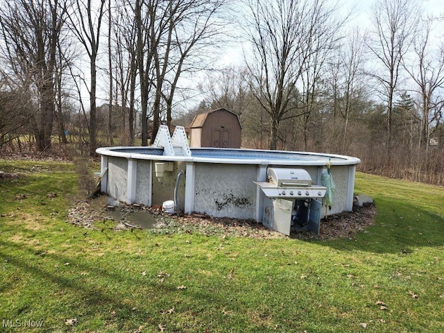 exterior space featuring an outbuilding and an outdoor pool
