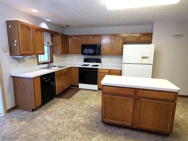 kitchen featuring brown cabinets, light countertops, a sink, and black appliances