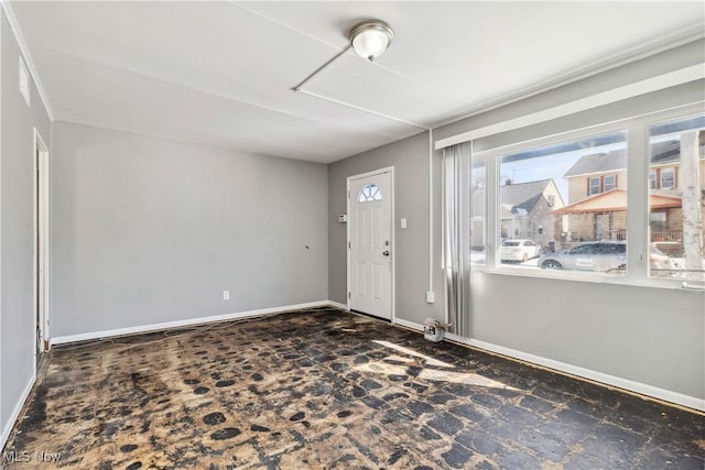 foyer entrance featuring baseboards