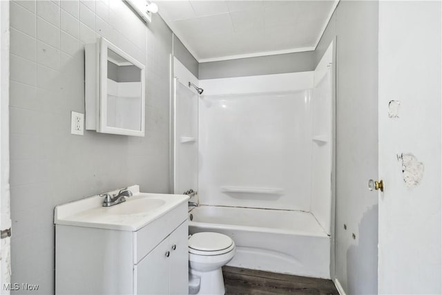 full bathroom with vanity, shower / bath combination, wood finished floors, and toilet