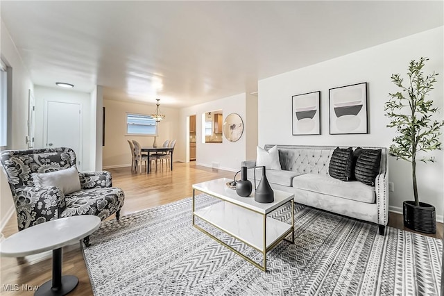 living room with light wood-style floors and baseboards