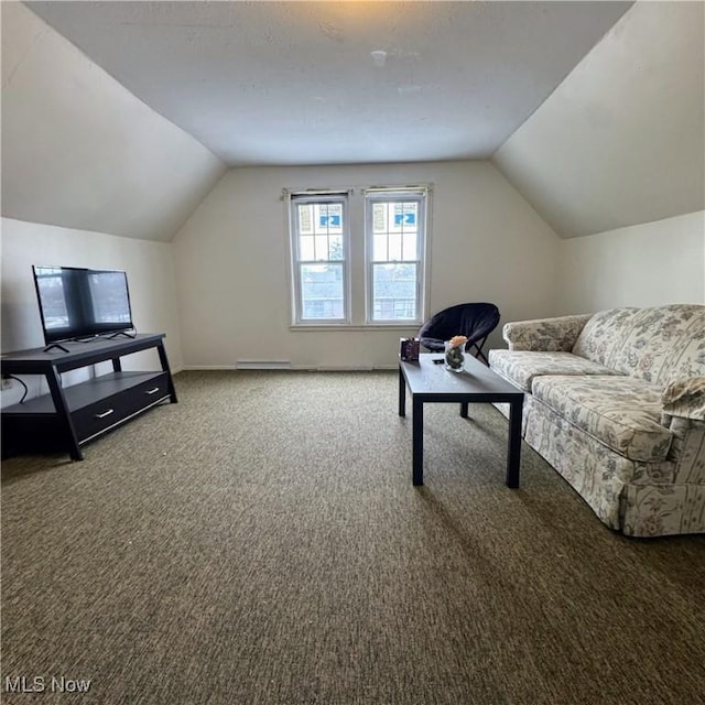 interior space featuring lofted ceiling and baseboards