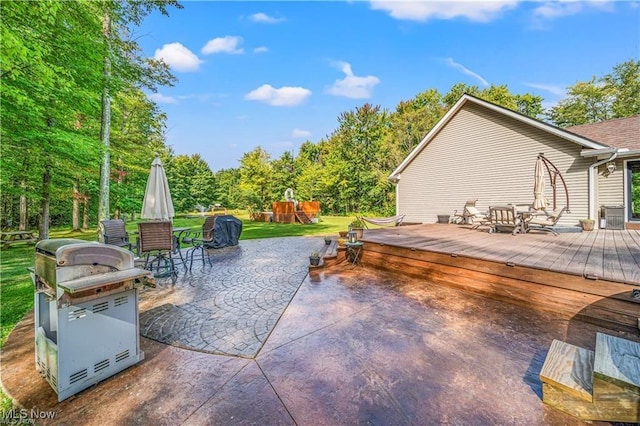 3945 Wheeler Creek Rd, Geneva, OH 44041 - view of patio featuring a deck, grilling area, and a playground