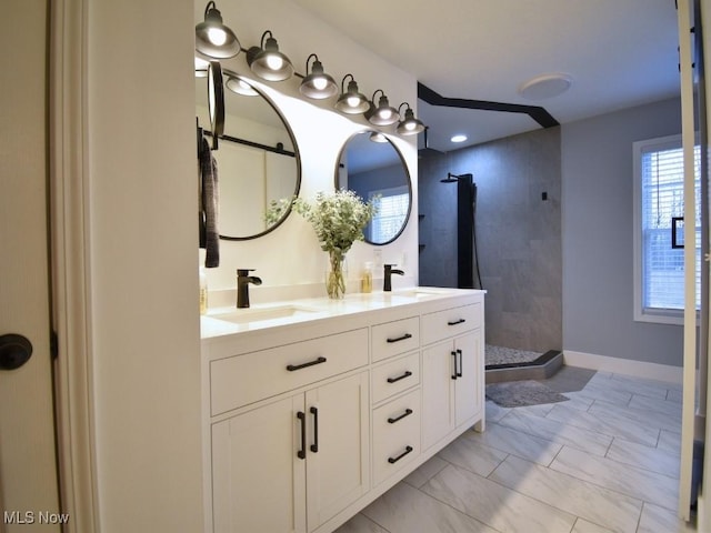 3945 Wheeler Creek Rd, Geneva, OH 44041 - bathroom featuring a sink, tiled shower, and marble finish floor
