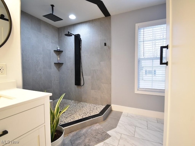 3945 Wheeler Creek Rd, Geneva, OH 44041 - full bathroom with marble finish floor, a walk in shower, vanity, and a healthy amount of sunlight