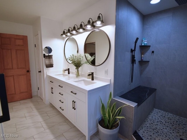 3945 Wheeler Creek Rd, Geneva, OH 44041 - bathroom with tiled shower, double vanity, marble finish floor, and a sink