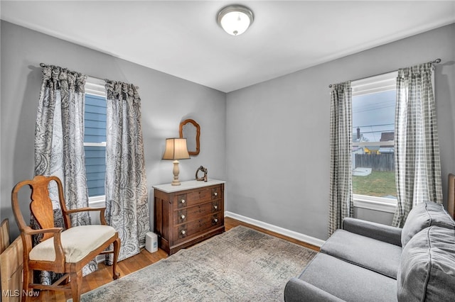 sitting room featuring wood finished floors and baseboards