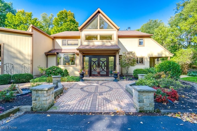 exterior space featuring french doors and stucco siding