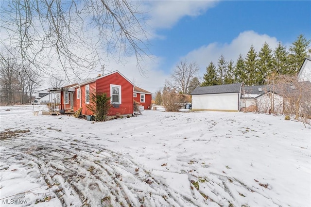 exterior space with an outbuilding, a shed, and a garage