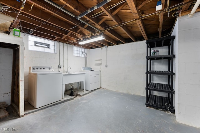 below grade area with washing machine and clothes dryer