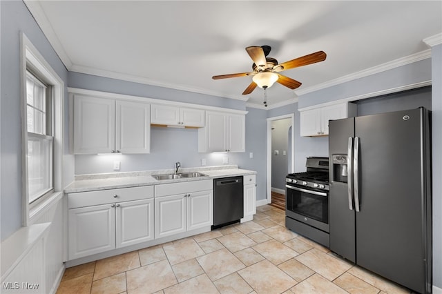 kitchen featuring appliances with stainless steel finishes, white cabinetry, a sink, and ornamental molding