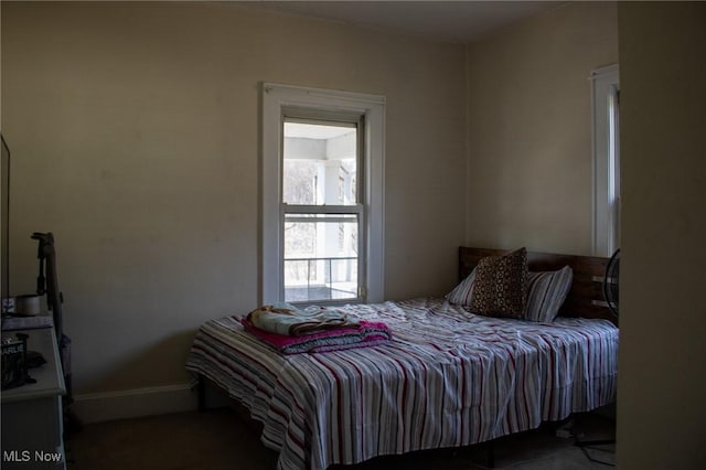 bedroom featuring baseboards