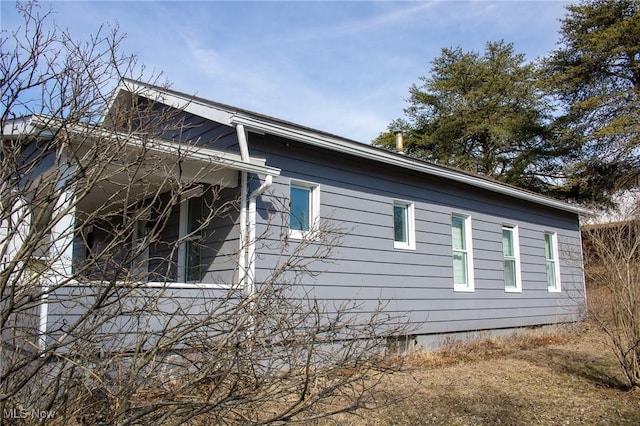 view of side of home with crawl space