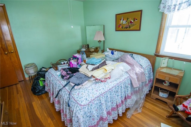 bedroom featuring wood finished floors