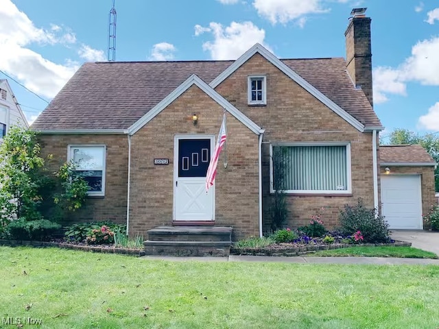 view of front of property featuring roof with shingles, a chimney, a front lawn, and brick siding