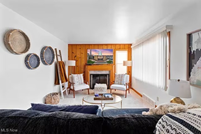 living room featuring carpet, visible vents, and a fireplace