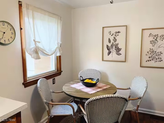 dining area featuring baseboards