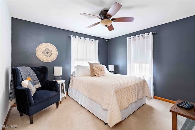 bedroom featuring carpet flooring, a ceiling fan, and baseboards