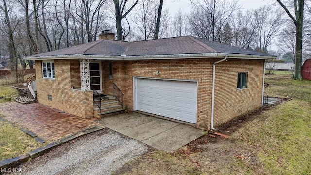 garage featuring driveway