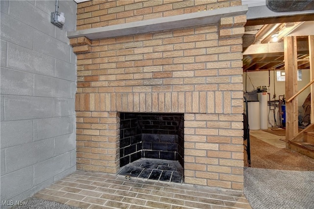 interior details with a brick fireplace