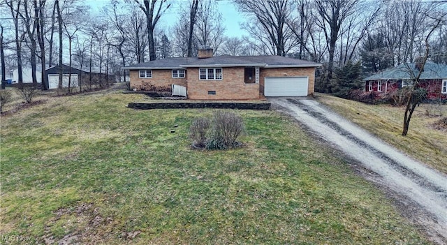 single story home with brick siding, a chimney, a garage, driveway, and a front lawn