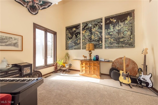 sitting room featuring carpet, visible vents, and baseboards