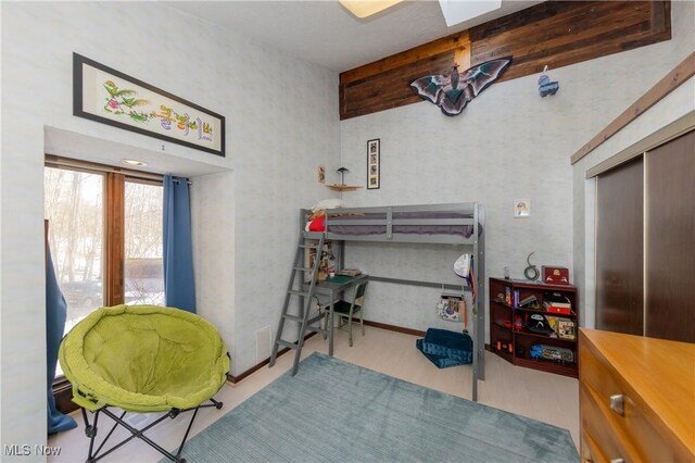 bedroom with a closet and wood finished floors