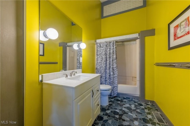 full bath with toilet, vanity, baseboards, shower / tub combo with curtain, and stone finish flooring