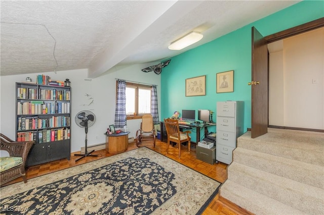 office featuring vaulted ceiling and a textured ceiling