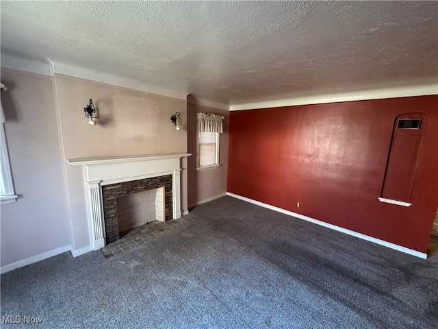 unfurnished living room featuring a textured ceiling, a fireplace, baseboards, and carpet flooring